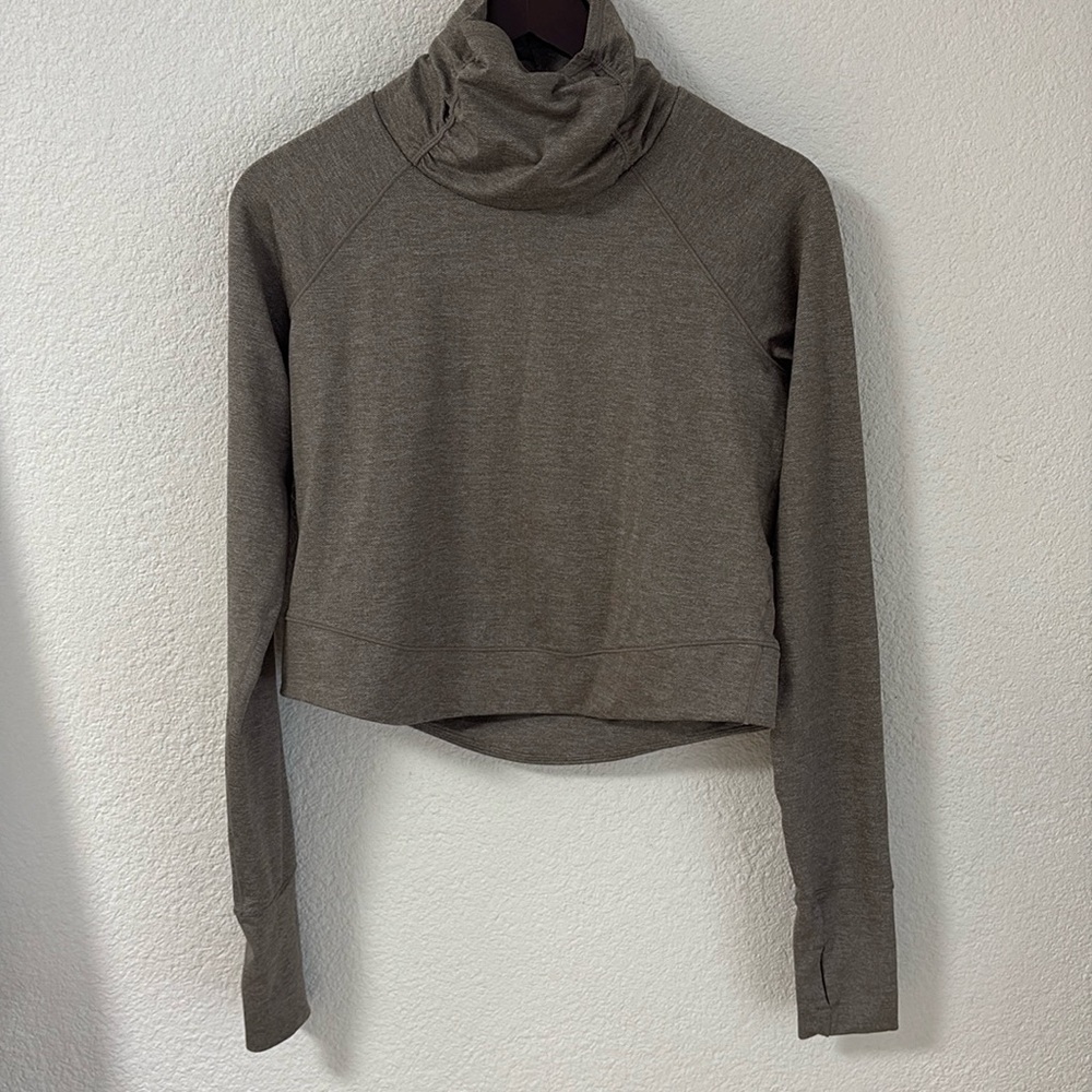 Prana Zawn top, funnel neck, high low, thumb holes. Color tan